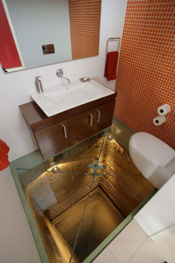 Glass floor and an open shaft to make your bathroom scary