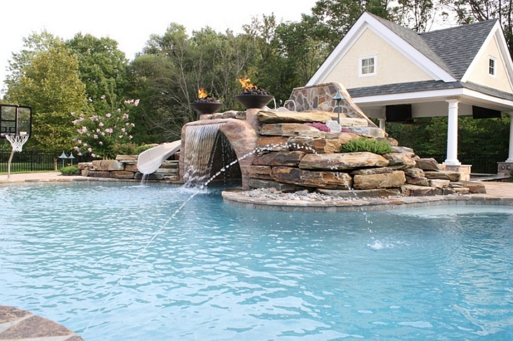Expansive-pool-with-a-water-slide-waterfall-feature-and-water-jets