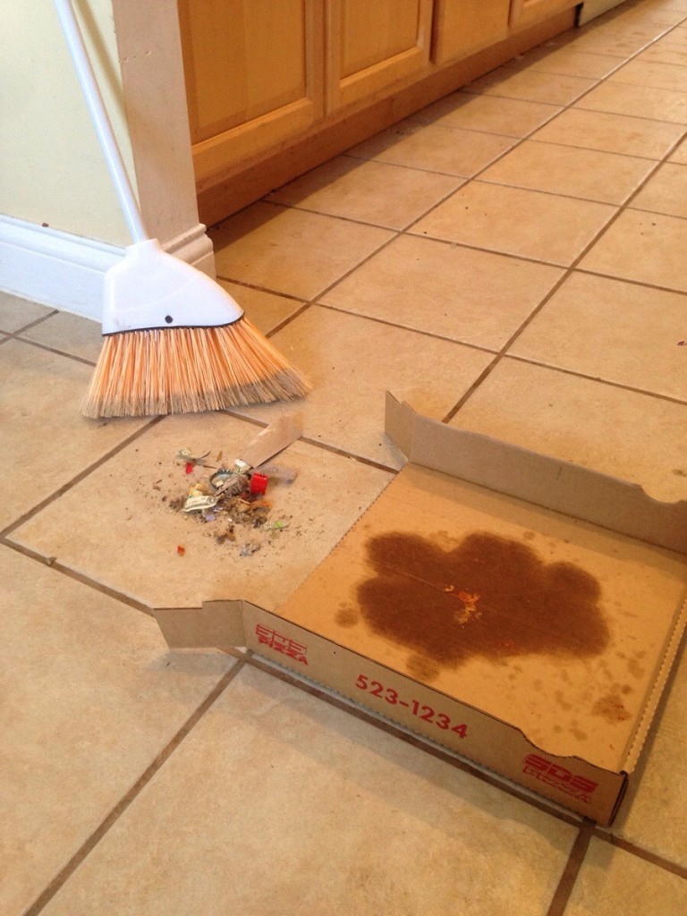 Instead of throwing the pizza box, use it as a dust pan or plates