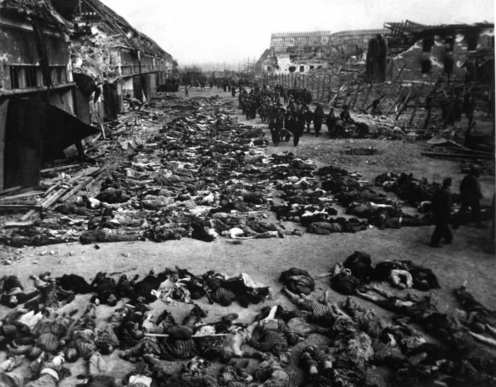 Rows_of_bodies_of_dead_inmates_fill_the_yard_of_Lager_Nordhausen,_a_Gestapo_concentration_camp