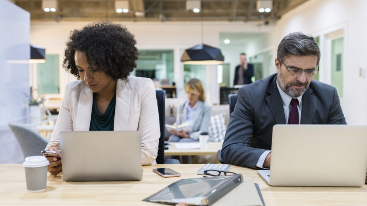 Business people working on digital devices
