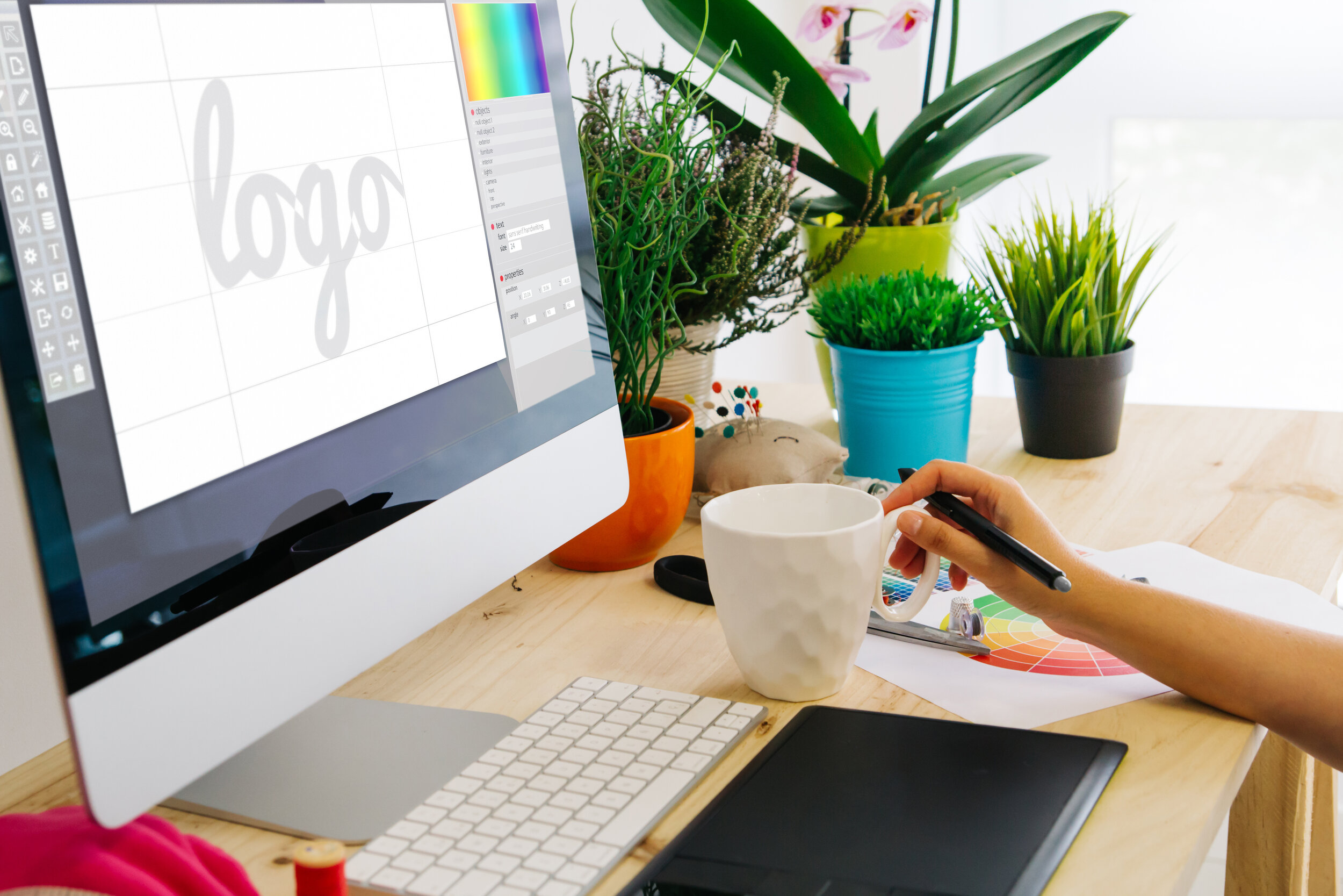 desk with computer and pen tablet logo design